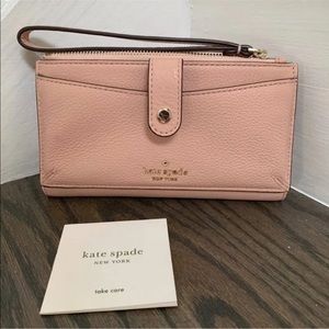 Kate Spade blush pink phone wristlet.